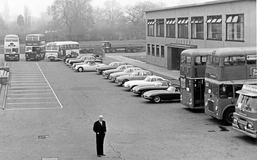 Sir William Lyons outside the Browns Lane office block in the early 60s, with products produced by the Jaguar Group